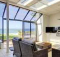 Whispering Sands 10 Sandy Point Road Luxury waterfront home with aircon WIFI  Foxtel - Accommodation Sunshine Coast